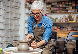 Woman smiling during pottery class