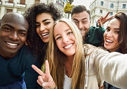 group of smiling attractive young adults