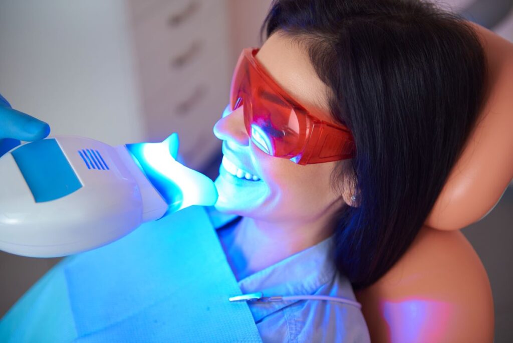 A woman getting professional teeth whitening